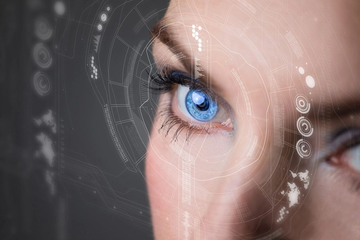 A woman 's eye with blue eyes and spider web around it.