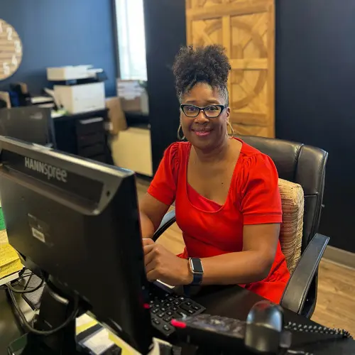 A woman sitting in front of a computer.